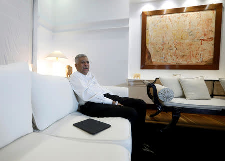Sri Lanka's ousted Prime Minister Ranil Wickremesinghe smiles as he speaks during an interview with Reuters at the Prime Minister's official residence in Colombo, Sri Lanka November 3, 2018. Picture taken November 3,2018. REUTERS/Dinuka Liyanawatte