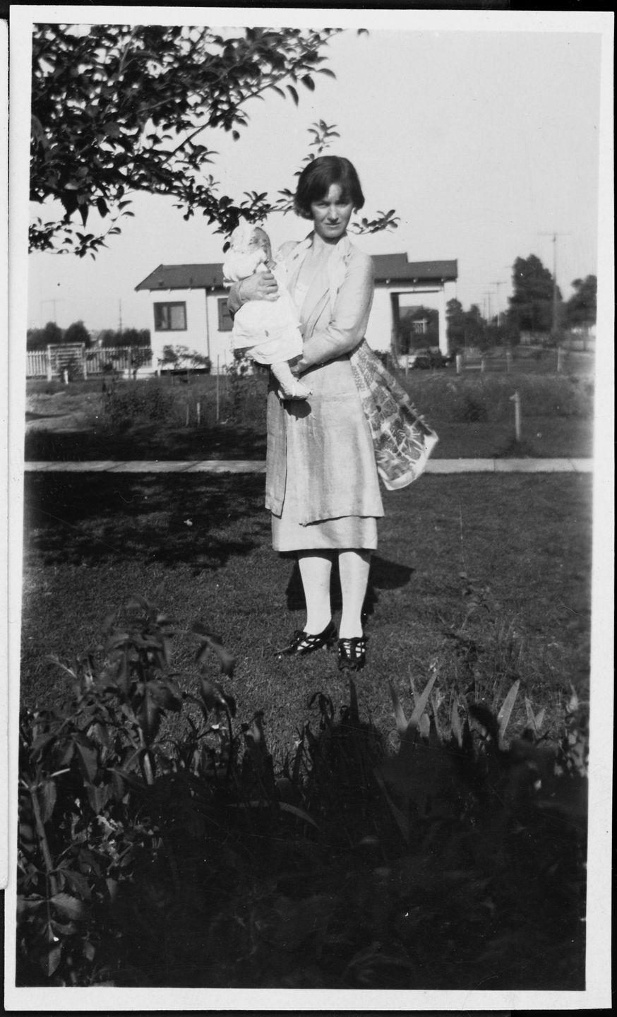 1926: Being held by her mom