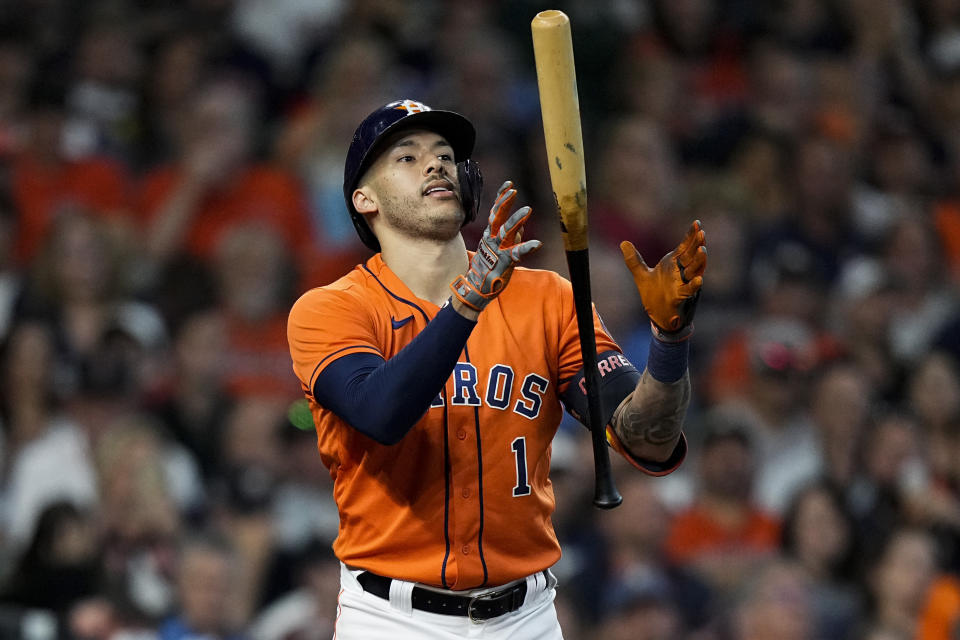 Houston Astros' Carlos Correa reacts after striking out against the Boston Red Sox during the sixth inning in Game 2 of baseball's American League Championship Series Saturday, Oct. 16, 2021, in Houston. (AP Photo/David J. Phillip)