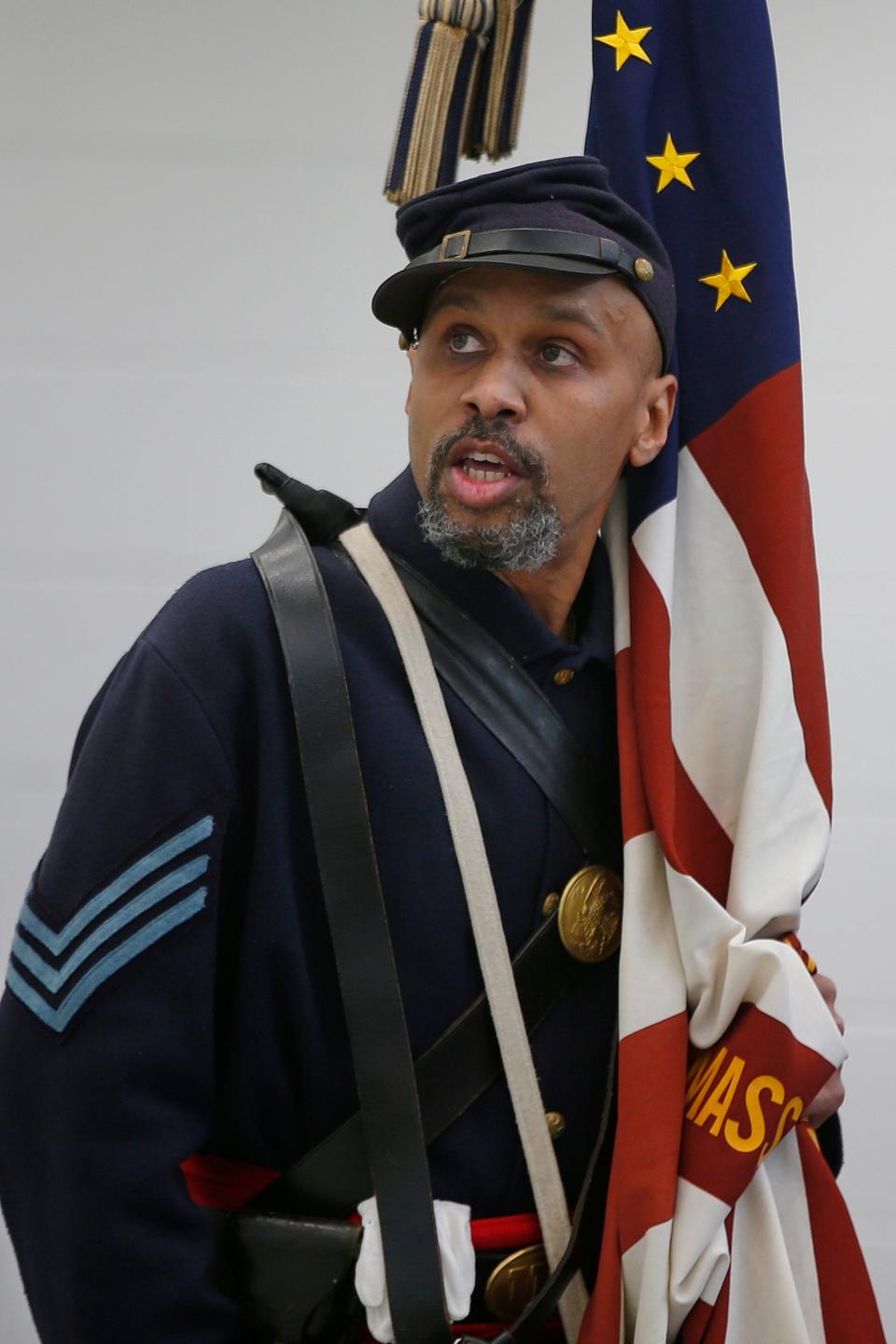 54th MA Volunteer Inf Reg Corporal Emmett Bell-Sykes sings a song while playing the part of Carney Academy's namesake Sgt. William H. Carney the first Black recipient of the Medal of Honor.