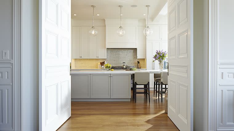 a kitchen with white cabinets