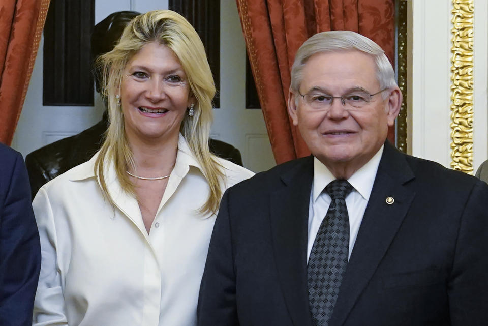 FILE - Senate Foreign Relations Committee Chairman, Sen. Bob Menendez, D-N.J., right, and his wife Nadine Arslanian, pose for a photo on Capitol Hill in Washington, Dec. 20, 2022. Arslanian, the then-future wife of Sen. Menendez, killed a man with her car in December 2018 and was sent from the scene without being charged, according to new details that match an auto “accident” that prosecutors cite in their sweeping federal indictment of the pair as a pivotal motivation for one of the senator's alleged bribes. (AP Photo/Susan Walsh, File)