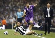 <p>Real Madrid’s Karim Benzema, right, and Juventus’ Leonardo Bonucci compete during the Champions League final soccer match between Juventus and Real Madrid at the Millennium stadium in Cardiff </p>