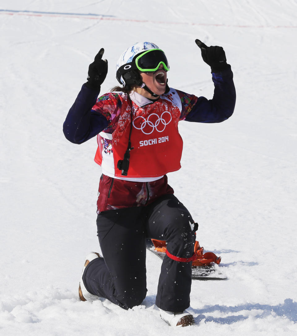 Czech Republic's Eva Samkova celebrates after taking the gold medal in the women's snowboard cross final at the Rosa Khutor Extreme Park, at the 2014 Winter Olympics, Sunday, Feb. 16, 2014, in Krasnaya Polyana, Russia. (AP Photo/Andy Wong)