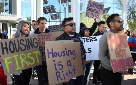 Protesters outside Las Vegas City Hall say housing shortages should be tackled before making 'surviving illegal' for the homeless - Credit: Bizuayehu Tesfaye/Las Vegas Review-Journal