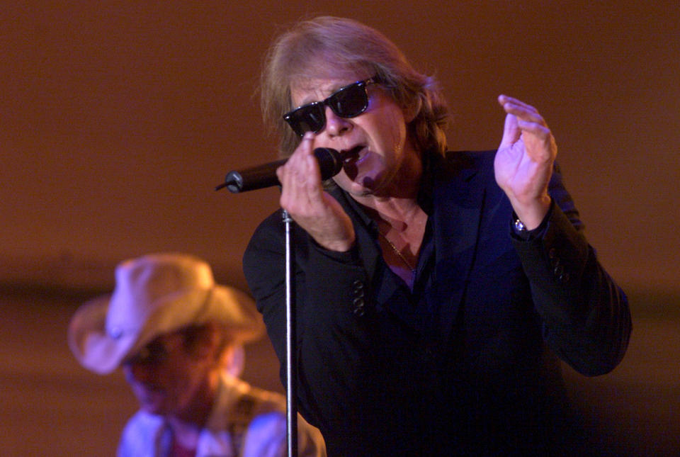 FILE - In this Aug. 6, 2004 file photo, Eddie Money performs during Grandstand Under the Stars at the Diamond Jo Casino in Dubuque, Iowa. Family members have said Eddie Money has died on Friday, Sept. 13, 2019. (Jessica Reilly/Telegraph Herald via AP, File)