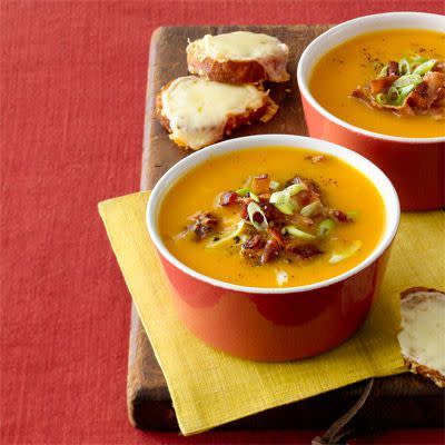 <p>Crumbled bacon on top of this fall-flavored soup adds a little luxury to your Thanksgiving table.</p><p><em><a href="https://www.womansday.com/food-recipes/food-drinks/recipes/a12083/butternut-squash-soup-recipe-wdy1112/" rel="nofollow noopener" target="_blank" data-ylk="slk:Get the recipe from Woman's Day »;elm:context_link;itc:0;sec:content-canvas" class="link ">Get the recipe from Woman's Day »</a></em></p>