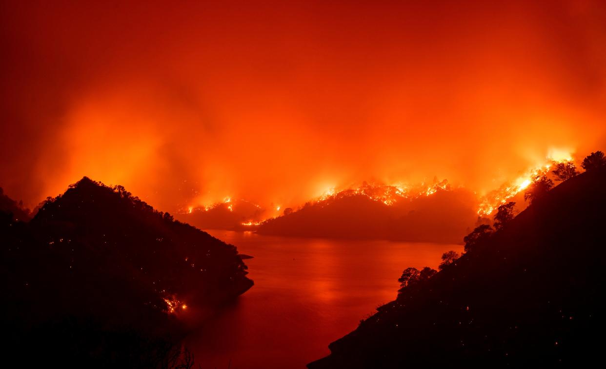 Flames surround Lake Berryessa during the August 2020 wildfires. (AFP via Getty Images)