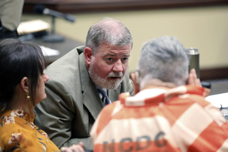 Defense attorney Boyd Young, talks to Frederick Hopkins during his sentencing hearing in Florence, S.C., on Thursday, Oct. 19, 2023. Hopkins was sentenced to life in prison without parole for killing two police officers and wounding five others in an October 2018 ambush at his Florence home (AP Photo/Jeffrey Collins).