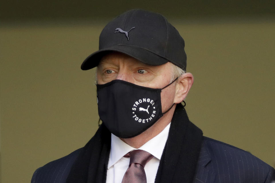 Retired German tennis player Boris Becker leaves Westminster Magistrates Court in London, after being declared bankrupt and accused of not complying with obligations to disclose information, Thursday, Sept. 24, 2020. Becker is being prosecuted by the Insolvency Service. (AP Photo/Matt Dunham)