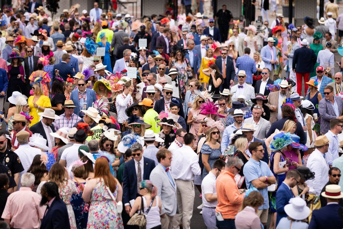 A crowd of guests moves past the paddock on Derby Day at Churchill Downs on Friday, May 6, 2023, in Louisville, Ky. (Jack Weaver/Herald-Leader) Jack Weaver