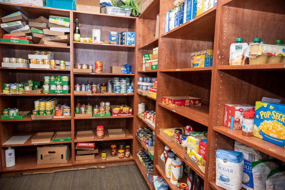 Shelves are stocked with non-perishable foods with lots of empty space that needs filled at the Salvation Army food pantry in Leesburg. [Cindy Peterson/Correspondent]