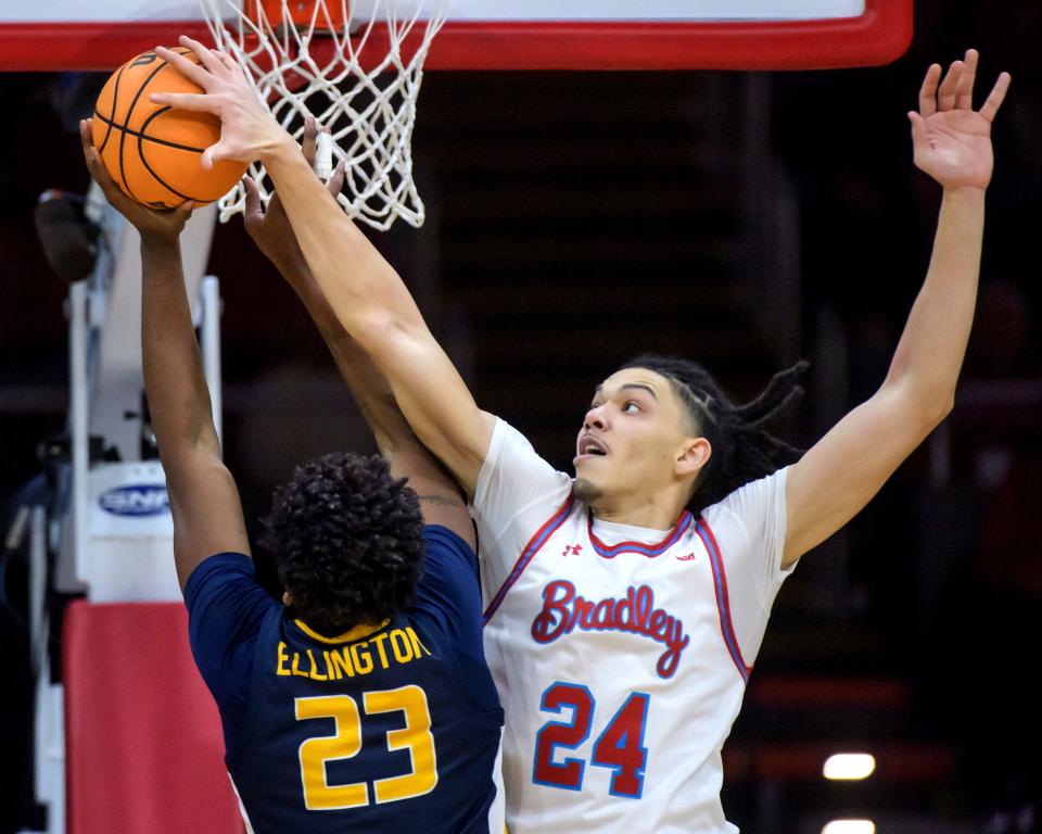 Bradley's Kyle Thomas (24) blocks a shot by Murray State's Nick Ellington in the first half of their Missouri Valley Conference basketball game Wednesday, Jan. 24, 2024 at Carver Arena in Peoria. The Braves defeated the Racers 71-63.