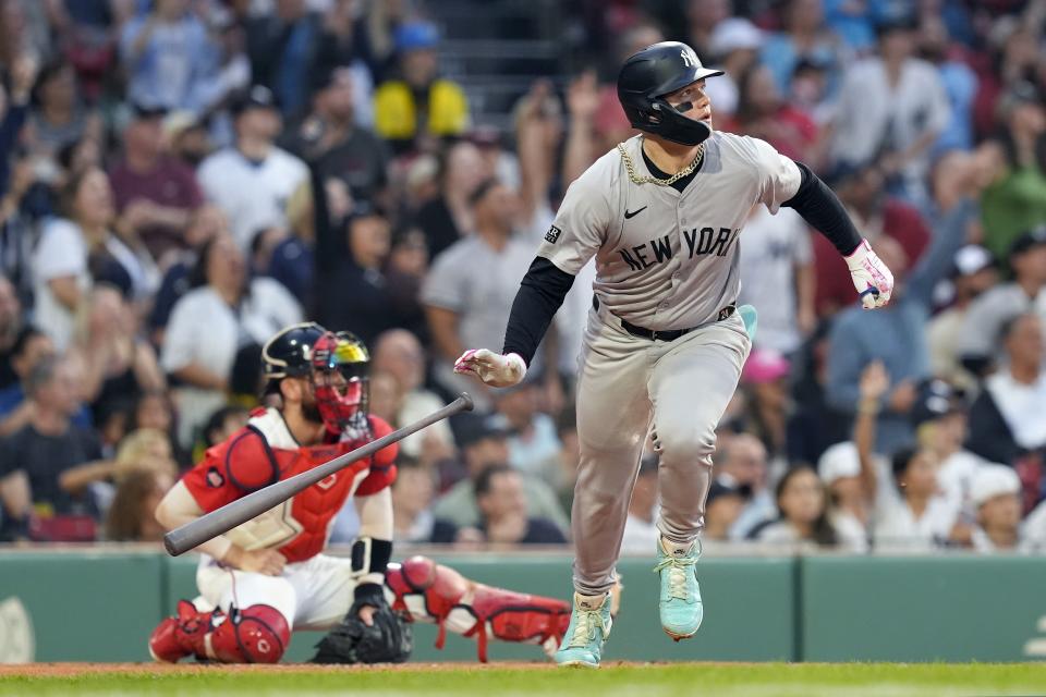 CORRECTS CATCHER TO CONNOR WONG, INSTEAD OF REESE MCGUIRE - New York Yankees' Alex Verdugo leaves the batter's box on his two-run home run, in front of Boston Red Sox catcher Connor Wong during the first inning of a baseball game Friday, June 14, 2024, in Boston. (AP Photo/Michael Dwyer)