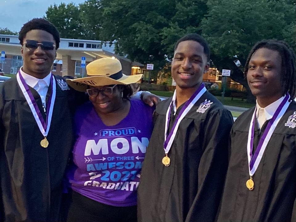 From left, triplets Joshua, Jeremiah and Jeffrey Davis with their mother, Elaine Haynes, as they celebrate the young men's graduation from Fletcher High School. Active with Boys & Girls Club Beaches since elementary school, the three young men were highlighted in a June 2021 story by Jean Sealey.