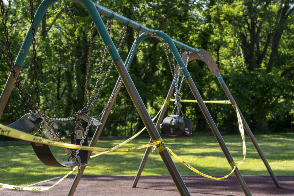 FILE - In this Saturday, May 30, 2020 file photo, the playground at the historic Glen Echo Park remains closed because of restrictions related to the coronavirus pandemic, in Glen Echo, Md., near Washington. Lawmakers in in the state used words like “stunning” and “unique” to describe how federal aid helped reshape their budget situation. Maryland's record $52.4 billion budget for its new fiscal year provides bonuses to state workers, boosts payments to the poor, builds parks and playgrounds in every county, and still sets aside about $2 billion for savings. (AP Photo/J. Scott Applewhite, File)