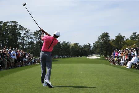 Tiger Woods of the U.S. hits a driver off the first tee during practice for the 2018 Masters golf tournament at Augusta National Golf Club in Augusta, Georgia, U.S. April 2, 2018. REUTERS/Jonathan Ernst