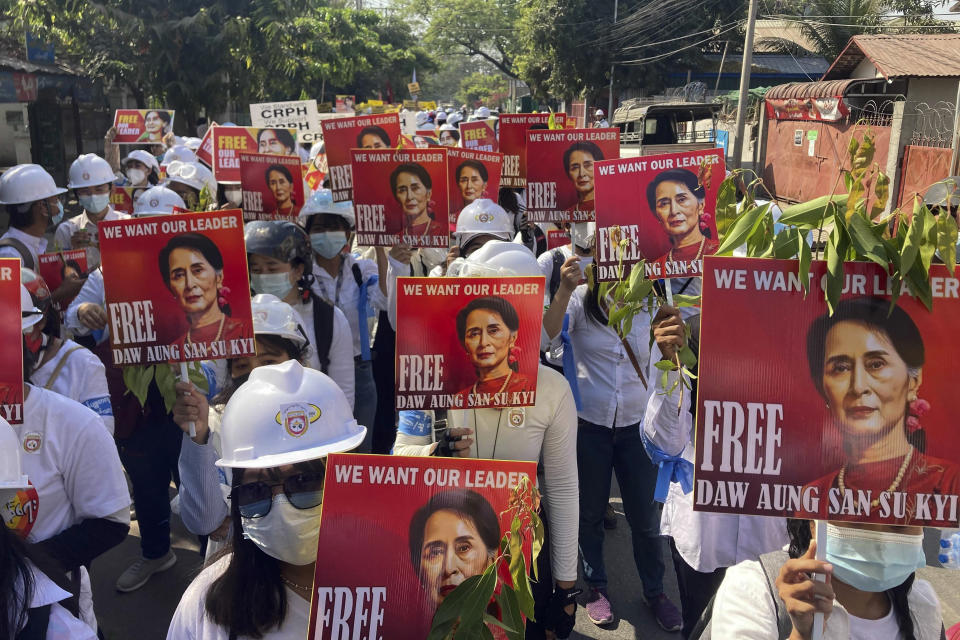 Protesters hold portraits of deposed Myanmar leader Aung San Suu Kyi during an anti-coup demonstration in Mandalay, Myanmar, Friday, March 5, 2021. Footage of a brutal crackdown on protests against a coup in Myanmar has unleashed outrage and calls for a stronger international response. (AP Photo)