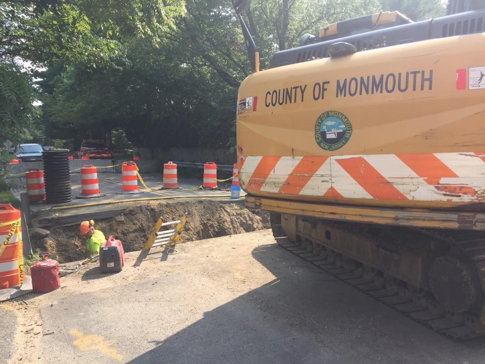 Repairs being made Thursday to the sinkhole on Allenwood Road.