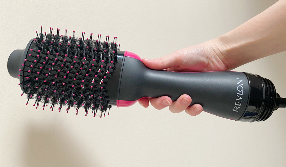 author holding the revlon hot air brush