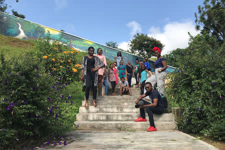 Tourist are seen gathered for a pose photograph at Ikogosi Warm Springs resort in Ekiti, Ekiti State, Nigeria November 11, 2018. Picture taken November 11, 2018. REUTERS/Seun Sanni