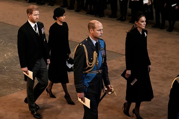 <div class="inline-image__caption"><p>Prince Harry, Meghan Markle, Prince William, and Kate Middleton walk behind the coffin as they arrive in the Palace of Westminster after the procession for the lying-in state of Queen Elizabeth II on Sept. 14, 2022, in London.</p></div> <div class="inline-image__credit">Nariman El-Mofty-WPA Pool/Getty</div>