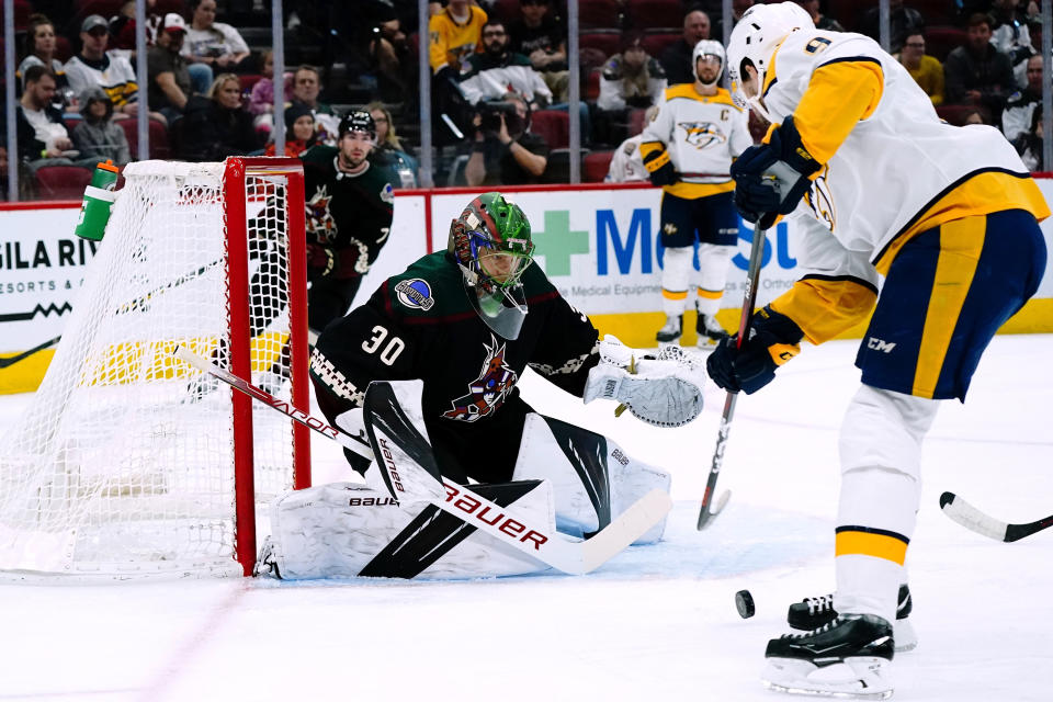 Arizona Coyotes goaltender Harri Sateri (30) makes a save on a shot by Nashville Predators left wing Filip Forsberg (9) during the second period of an NHL hockey game Friday, April 29, 2022, in Glendale, Ariz. (AP Photo/Ross D. Franklin)