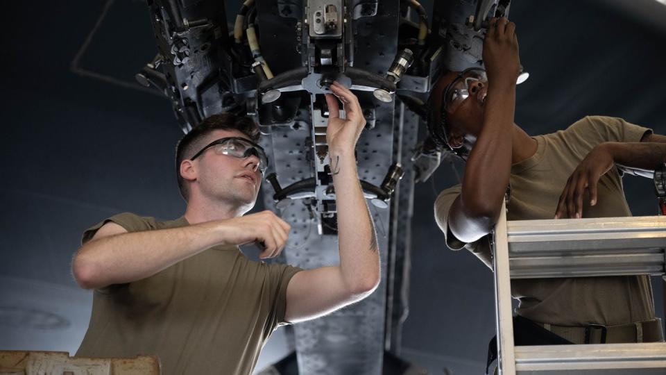 Airman 1st Class Zachary Dawson and Senior Airman Dakeeja Nelson perform a serviceability check on a B-52 Stratofortress bomb rack at Barksdale Air Force Base, La., on May 12, 2023. (Airman 1st Class Nicole Ledbetter/U.S. Air Force)