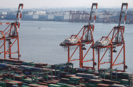 FILE PHOTO: Shipping containers are seen at a port in Tokyo, Japan, March 22, 2017. REUTERS/Issei Kato