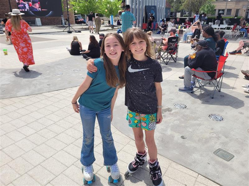 Evelyn Holsten, left, and Harper Jones, both 10, met while watching the solar eclipse on Monday, April 8, 2024, in Little Rock, Ark.