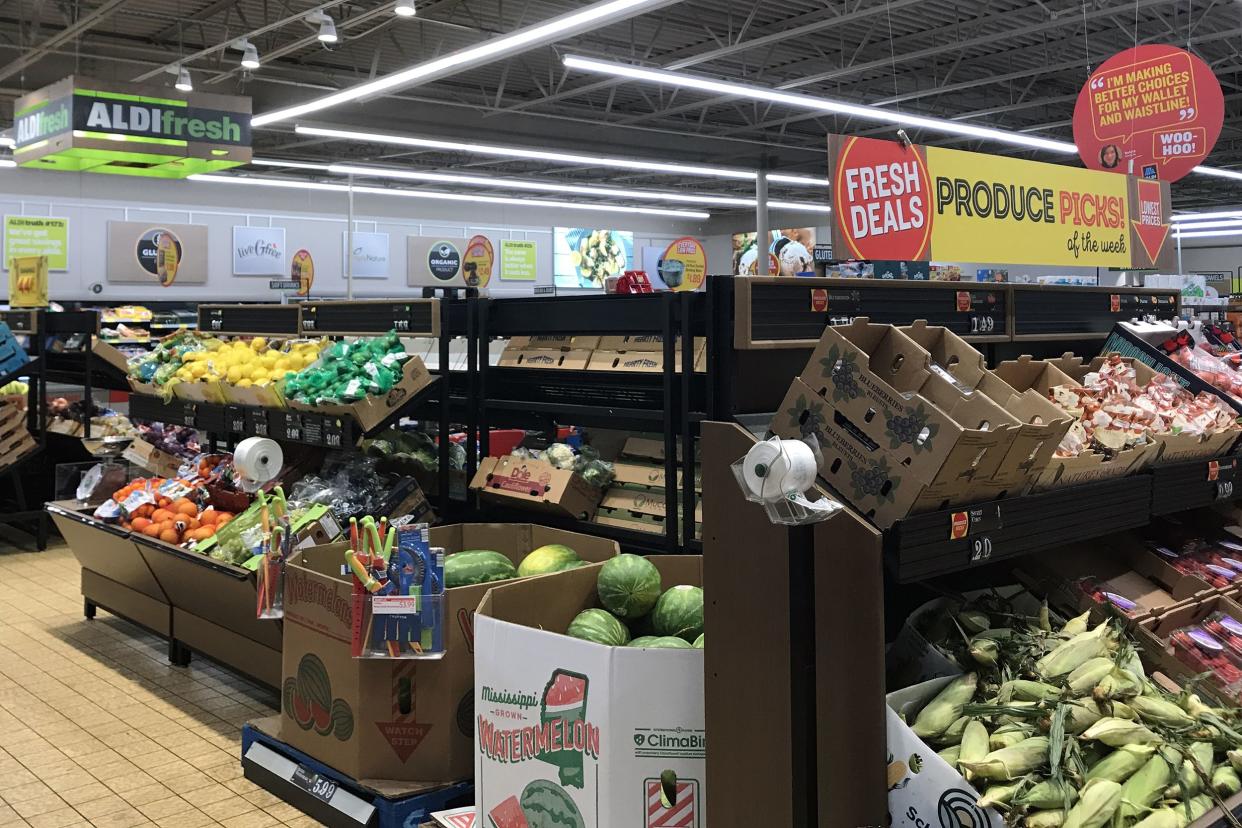 Produce area at an Aldi store, very clean and organized, 'Fresh Deals' section on the far right, several different kinds of vegetables and fruits are on display