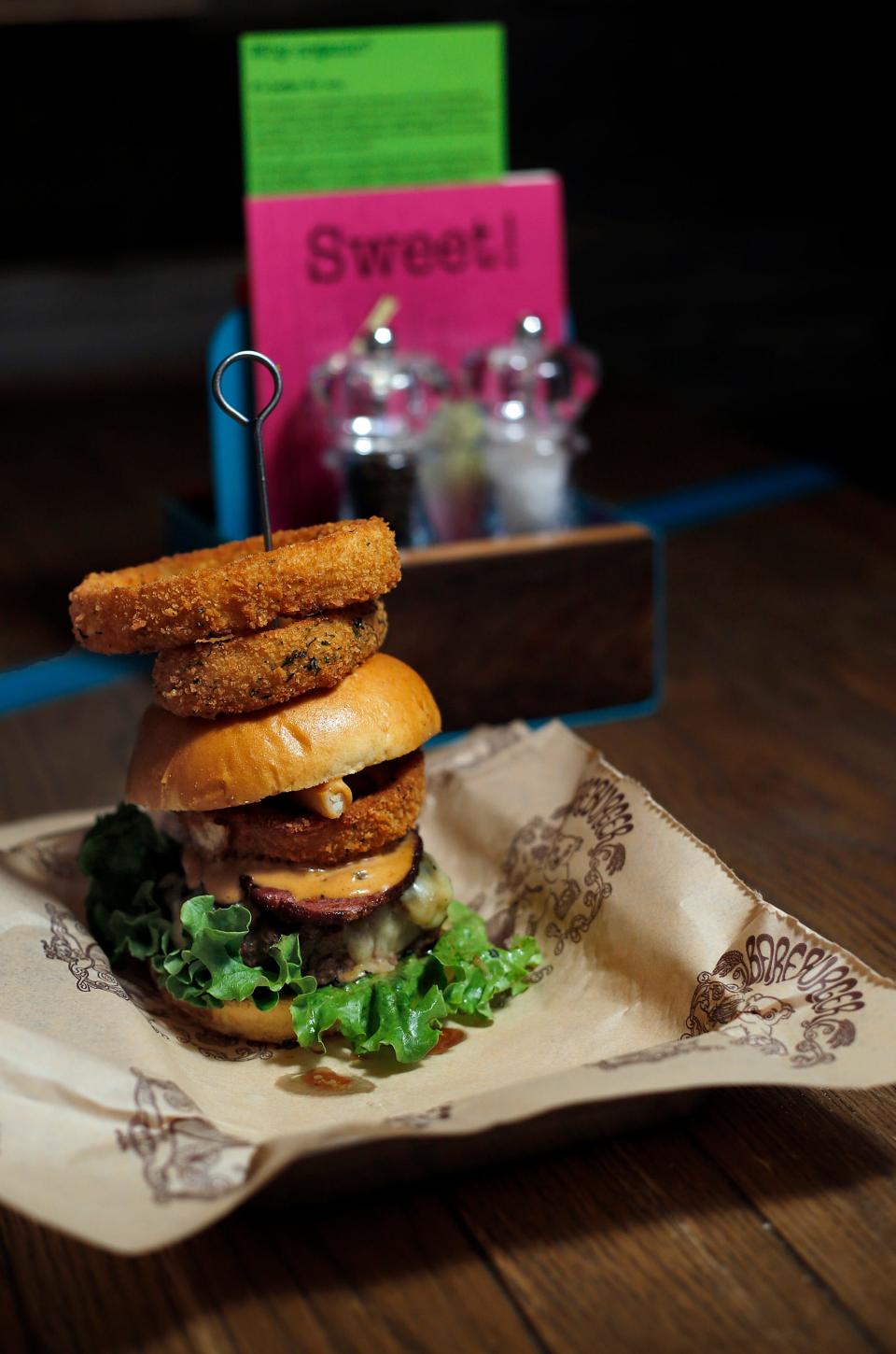 The Supreme burger at the newly opened Bareburger at 463 North High Street in 2014 features Colby Jack cheese, country bacon, chopped fries, Bareburger onion rings, green leaf lettuce and special sauce.