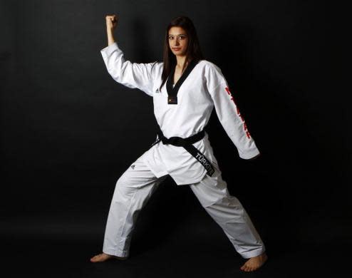 Turkish Taekwondo fighter and Olympic hopeful Nur Tatar, 20, poses in Ankara May 24, 2012.