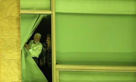 Brazil's President Dilma Rousseff, accompanied by Chief of Staff Jaques Wagner, stand at a window at Planalto Palace in Brasilia, Brazil, May 11, 2016. REUTERS/Adriano Machado