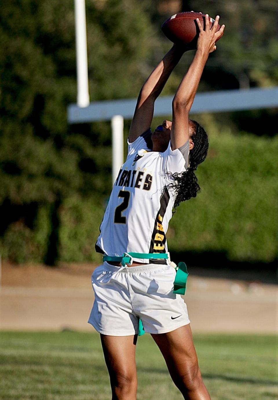 San Pedro receiver Noelani Raigans makes a leaping, two-handed catch above her head.