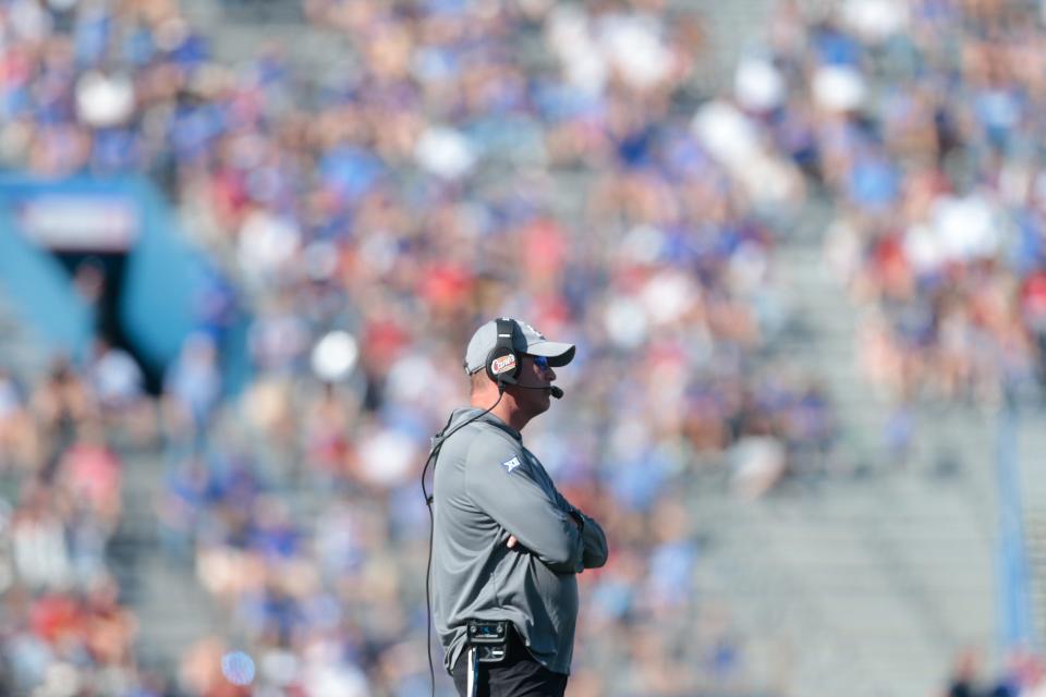 Kansas coach Lance Leipold waits on the field while a play is reviewed during the second quarter of a game during the 2022 season against Iowa State inside David Booth Kansas Memorial Stadium.