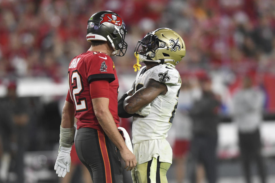 New Orleans Saints defensive back Chauncey Gardner-Johnson (22) taunts Tampa Bay Buccaneers quarterback Tom Brady (12) after Brady fumbled the football during the second half of an NFL football game Sunday, Dec. 19, 2021, in Tampa, Fla. (AP Photo/Jason Behnken)