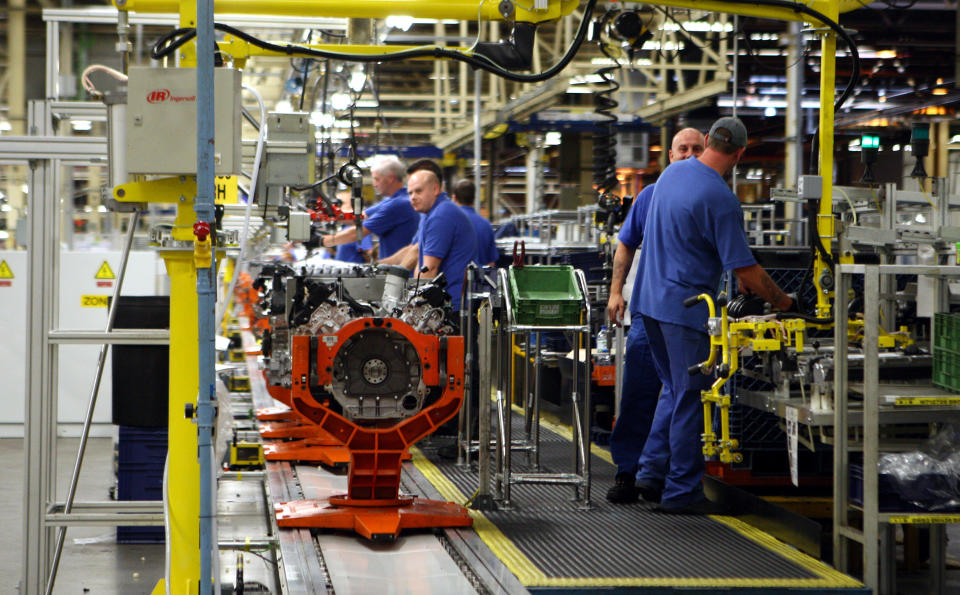 Engineers working on a Jaguar V8 engine at the Ford engine plant near Bridgend, south Wales.