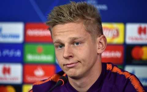 Manchester City's Ukrainian midfielder Oleksandr Zinchenko looks on during a press conference of Manchester City at the Metallist stadium in Kharkiv - Credit: AFP