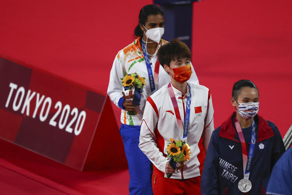 Tokyo 2020 Olympics - Badminton - Women's Singles - Medal Ceremony - MFS - Musashino Forest Sport Plaza, Tokyo, Japan – August 1, 2021. Gold medallist Chen Yufei of China, silver medallist Tai Tzu-Ying of Taiwan and bronze medallist P.V. Sindhu of India walk with their medals. REUTERS/Hamad I Mohammed