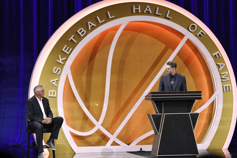 Pau Gasol, right, speaks during his enshrinement at the Basketball Hall of Fame as presenter Toni Kukoc, left, listens Saturday, Aug. 12, 2023, in Springfield, Mass. (AP Photo/Jessica Hill)