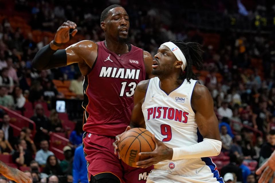 Detroit Pistons forward Jerami Grant drives to the basket as Miami Heat center Bam Adebayo defends during the first half Tuesday, March 15, 2022, in Miami.