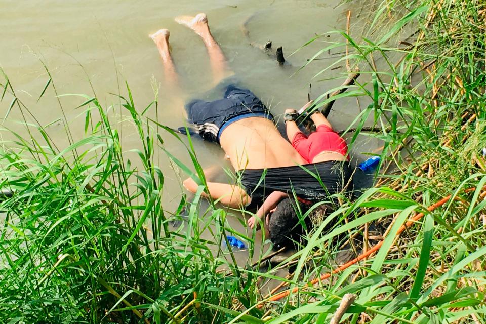 EDS NOTE: GRAPHIC CONTENT - The bodies of Salvadoran migrant Oscar Alberto Martínez Ramírez and his nearly 2-year-old daughter Valeria lie on the bank of the Rio Grande in Matamoros, Mexico, Monday, June 24, 2019, after they drowned trying to cross the river to Brownsville, Texas. Martinez' wife, Tania told Mexican authorities she watched her husband and child disappear in the strong current. (AP Photo/Julia Le Duc) ORG XMIT: MEX301