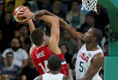 Kevin Durant fouls Nikola Jokic of Serbia. REUTERS/Jim Young