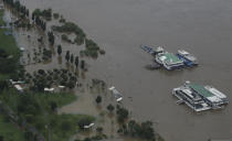 A part of a park near the Han River are flooded due to heavy rain in Seoul, South Korea, Thursday, Aug. 6, 2020. Torrential rains continuously pounded South Korea on Thursday, prompting authorities to close parts of highways and issue a rare flood alert near a key river bridge in Seoul. (AP Photo/Lee Jin-man)