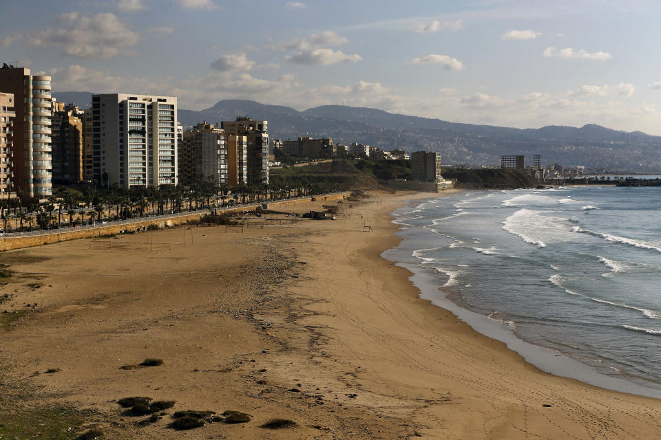 The Ramlet al-Baida public beach is empty during a lockdown aimed at curbing the spread of the coronavirus, in Beirut Lebanon, Thursday, Jan. 21, 2021. Authorities on Thursday extended a nationwide lockdown by a week to Feb. 8 amid a steep rise in coronavirus deaths and infections that has overwhelmed the health care system. (AP Photo/Bilal Hussein)