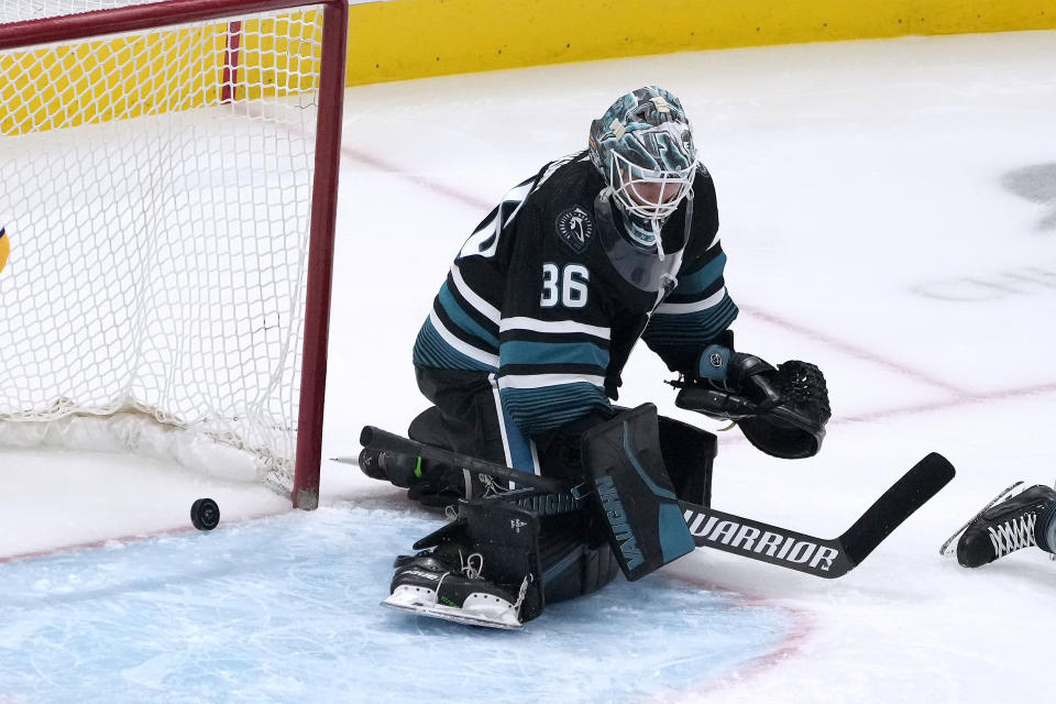 San Jose Sharks goaltender Kaapo Kahkonen (36) can't make the stop on a goal by Nashville Predators' Kiefer Sherwood during the third period of an NHL hockey game Saturday, Feb. 24, 2024, in San Jose, Calif. (AP Photo/Tony Avelar)