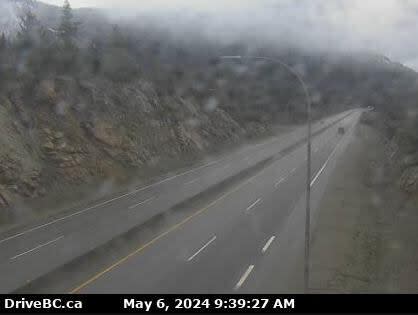 A webcam of the Coquihalla Highway on Monday morning, which was showing rain but no snow. A frontal system moving through B.C. on Monday could bring flurries to some mountain passes, Environment Canada warned.  (DriveBC/B.C. Ministry of Transportation - image credit)