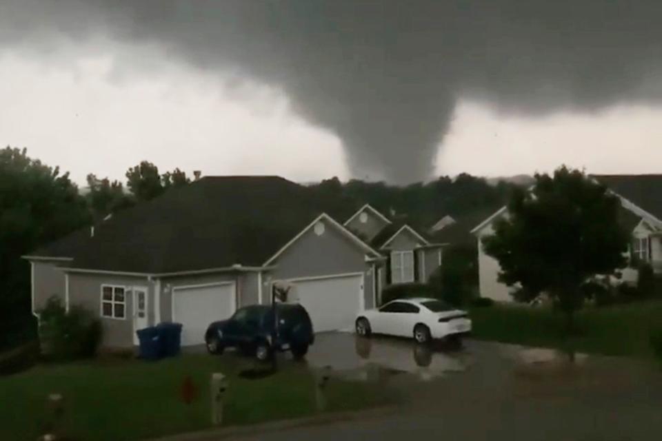 This still image taken from video provided by Chris Higgins shows a tornado in Carl Junction, Mo., on Wednesday, May 22, 2019. The tornado caused damage in the town about 4 miles (6.44 kilometers) north of the Joplin airport. (Chris Higgins via AP) ORG XMIT: CAET599