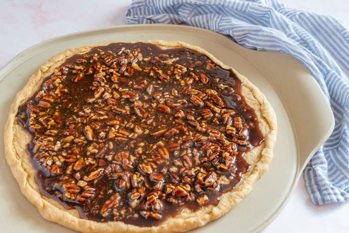 Pecan Pizza Coffee Cake dough with topping ready to bake